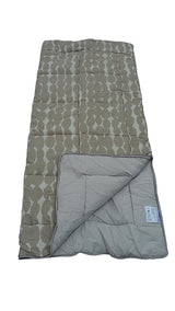 Folded quilt with geometric pattern on a white background